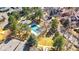 Aerial view of community pool surrounded by mature trees and landscaping at 6001 S Yosemite St # H204, Greenwood Village, CO 80111