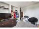 Functional bedroom with walk-in closet, dresser, TV, and a neutral color palette at 2567 Rainbow Dr # 80, Denver, CO 80229