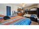 Shared bedroom with bunk bed, full bed, dresser, and cozy decor at 2567 Rainbow Dr # 80, Denver, CO 80229