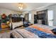 Shared bedroom with bunk beds, a full bed, and a large window for natural light at 2567 Rainbow Dr # 80, Denver, CO 80229