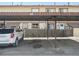 View of covered carport parking area, showing assigned spots and property units in the background at 2567 Rainbow Dr # 80, Denver, CO 80229