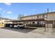 Exterior view of covered carport parking area with spaces for residents and their vehicles on a sunny day at 2567 Rainbow Dr # 80, Denver, CO 80229