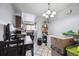 Bright dining area with tiled floor, a six-light chandelier, and ample storage space at 2567 Rainbow Dr # 80, Denver, CO 80229