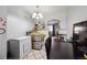 Inviting dining area, complete with a chandelier and archway leading to the living space at 2567 Rainbow Dr # 80, Denver, CO 80229