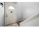 Interior entryway showcasing the front door, tile flooring, and the stairway leading to upper level at 2567 Rainbow Dr # 80, Denver, CO 80229