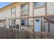 Exterior facade showing back patio, door, and other building elements of the property at 2567 Rainbow Dr # 80, Denver, CO 80229