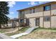 View of the townhome units, highlighting the exterior design and individual entrances from street at 2567 Rainbow Dr # 80, Denver, CO 80229