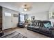 Spacious living room with plush furniture, carpet flooring, and large windows for natural light at 2567 Rainbow Dr # 80, Denver, CO 80229