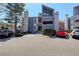 View of the apartment complex exterior showcasing its architecture and parking area at 6490 S Dayton St # L10, Englewood, CO 80111