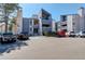 View of the apartment complex exterior showcasing its architecture and parking area at 6490 S Dayton St # L10, Englewood, CO 80111
