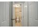 Bathroom includes a tiled shower with a glass door and a modern toilet and towel bar at 6490 S Dayton St # L10, Englewood, CO 80111