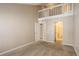 Spacious bedroom features neutral carpet, paint and access to a private bathroom at 6490 S Dayton St # L10, Englewood, CO 80111
