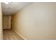 This hallway has neutral colored walls and carpeted floor at 6490 S Dayton St # L10, Englewood, CO 80111