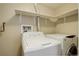 Laundry room with appliances and shelving at 6490 S Dayton St # L10, Englewood, CO 80111