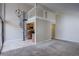 Living room showcasing open floor plan with a spiral staircase and a kitchen at 6490 S Dayton St # L10, Englewood, CO 80111