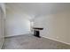 View of living room highlighting a fireplace and large windows with blinds at 6490 S Dayton St # L10, Englewood, CO 80111