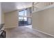 Cozy living room featuring sliding glass doors with an adjacent work space at 6490 S Dayton St # L10, Englewood, CO 80111