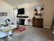 Inviting living room features a fireplace, neutral colors, and carpeted floors, perfect for relaxation and entertaining at 6490 S Dayton St # L10, Englewood, CO 80111