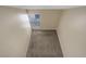 Loft area featuring neutral walls, plush carpeting, and a white railing overlooking the downstairs at 6490 S Dayton St # L10, Englewood, CO 80111