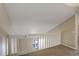 Loft area featuring neutral walls, plush carpeting, and a white railing overlooking the downstairs at 6490 S Dayton St # L10, Englewood, CO 80111