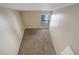 Loft area featuring neutral walls, plush carpeting, and a white railing overlooking the downstairs at 6490 S Dayton St # L10, Englewood, CO 80111