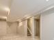 A basement with carpet, recessed lighting, structural support columns, and a door to a storage room at 4287 Brookwood Pl, Highlands Ranch, CO 80130
