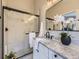 Modern bathroom with a marble-tiled shower, sleek glass door, marble countertops, and stylish fixtures, creating a luxurious space at 4287 Brookwood Pl, Highlands Ranch, CO 80130