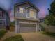 Charming two-story home features a two car garage and manicured lawn at 4287 Brookwood Pl, Highlands Ranch, CO 80130
