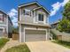 Charming two-story home features a two car garage and manicured lawn at 4287 Brookwood Pl, Highlands Ranch, CO 80130
