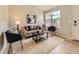 Bright living room with large windows, stylish furnishings, and modern decor at 4287 Brookwood Pl, Highlands Ranch, CO 80130