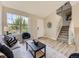 Bright living room with large windows, stylish furnishings, and modern decor at 4287 Brookwood Pl, Highlands Ranch, CO 80130