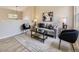 Bright living room with large windows, stylish furnishings, and modern decor at 4287 Brookwood Pl, Highlands Ranch, CO 80130