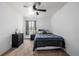 Cozy bedroom with a ceiling fan and natural light at 5995 W Hampden Ave # 20B, Denver, CO 80227