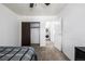 Bedroom featuring a closet and a doorway to the laundry room at 5995 W Hampden Ave # 20B, Denver, CO 80227