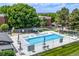 Community pool area offers a refreshing recreational space, surrounded by lounge chairs and umbrellas at 5995 W Hampden Ave # 20B, Denver, CO 80227