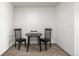 Small dining area featuring a black table and seating for two at 5995 W Hampden Ave # 20B, Denver, CO 80227