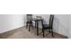 Small dining area with a table and chairs set on neutral carpet at 5995 W Hampden Ave # 20B, Denver, CO 80227