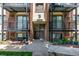 A brick apartment building with black metal balconies and access stairs for each unit at 5995 W Hampden Ave # 20B, Denver, CO 80227