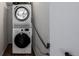 Laundry closet featuring a stacked Electrolux washer and Samsung dryer at 5995 W Hampden Ave # 20B, Denver, CO 80227