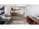 An open concept living room and kitchen with white appliances at 5995 W Hampden Ave # 20B, Denver, CO 80227