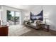 Cozy living room with balcony and a scenic mural wall decor at 5995 W Hampden Ave # 20B, Denver, CO 80227