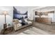 Open-concept living area featuring a kitchen with wood cabinets at 5995 W Hampden Ave # 20B, Denver, CO 80227