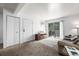 A living room with access to a balcony and an air conditioner at 5995 W Hampden Ave # 20B, Denver, CO 80227