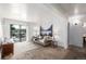 Bright living room with an open balcony, modern decor, and ample natural light at 5995 W Hampden Ave # 20B, Denver, CO 80227