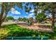 Community playground area offers swings and a slide in a shared recreational space for residents at 5995 W Hampden Ave # 20B, Denver, CO 80227