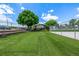 Outdoor recreation area featuring a fenced in basketball court and grassy area at 5995 W Hampden Ave # 20B, Denver, CO 80227