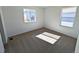 Bright bedroom featuring carpet floors, a large window and neutral color palette at 8205 Rockvale Dr, Littleton, CO 80125