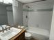 Freshly updated bathroom with tub and shower, modern fixtures and vanity with sink at 2441 S Xanadu Way # A, Aurora, CO 80014