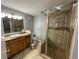 Main bathroom featuring tiled shower and tile floors at 2441 S Xanadu Way # A, Aurora, CO 80014