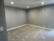Neutral bedroom featuring fresh carpet, light fixtures, and painted walls at 2441 S Xanadu Way # A, Aurora, CO 80014